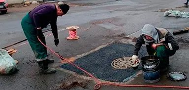 Бумажная, 9. Ремонт асфальта у дренажного люка